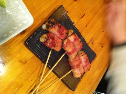 Bacon-wrapped mochi yakitori. Interesting. Bacon and rice? Why not! Throw in the egg and it's a Filipino breakfast on a stick!